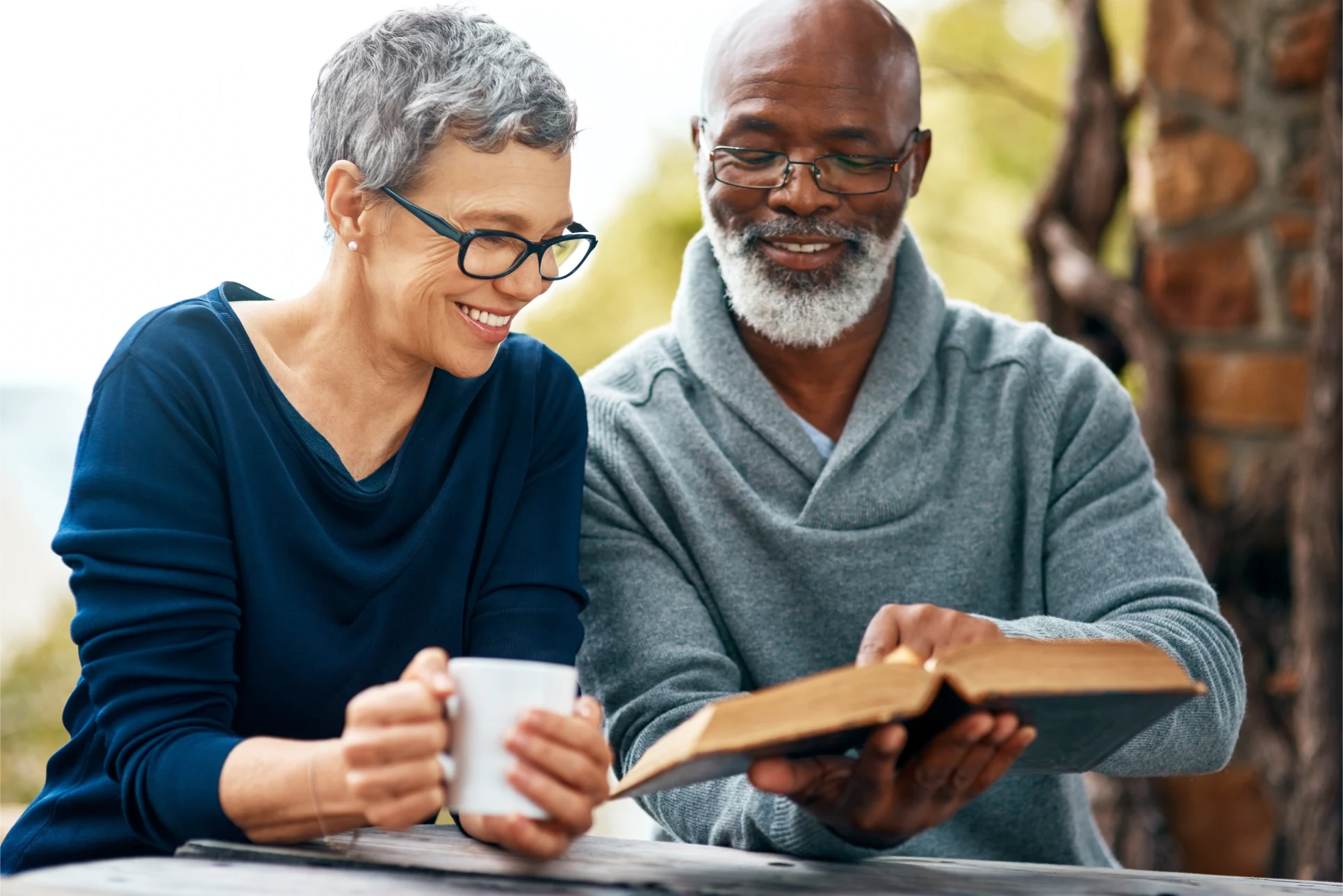 Elderly Couple Reading a Bible Together