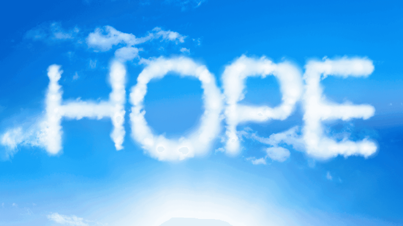 The word HOPE is written in white, fluffy clouds against a bright blue sky with the sun shining below.